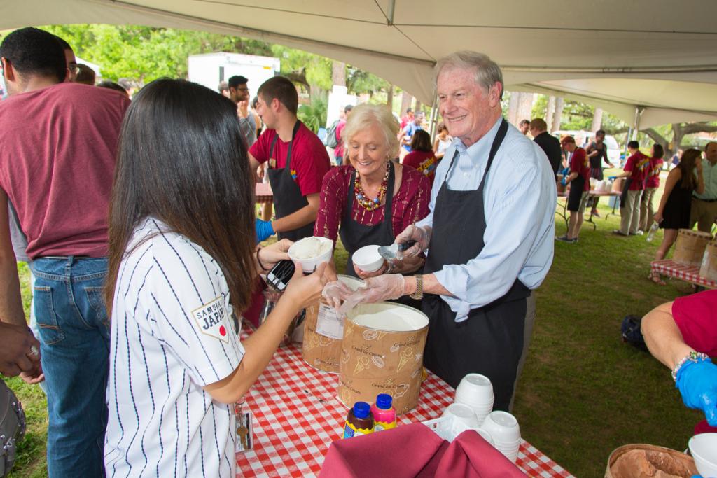 President John Thrasher and FSU First Lady Jean Thrasher scoop ice cream during the President's Ice Cream Social on Landis Green April 2, 2015. (FSU Photography Services)