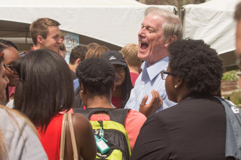 President John Thrasher laughs with students during the President's Ice Cream Social on Landis Green April 6, 2016. (FSU Photography Services)