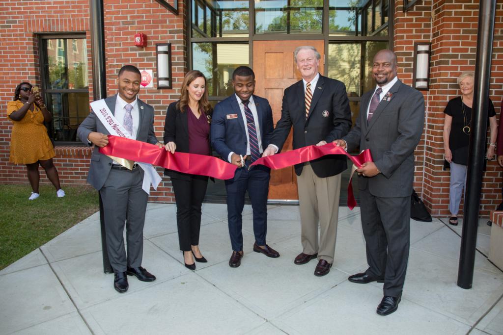 Ki-mani Ward, Vice President for Student Affairs Amy Hecht, Maurice Wedderburn, President John Thrasher and Ahli Moore, in front of FSU's new Black Student Union building during an official ribbon-cutting ceremony Oct. 19, 2018.