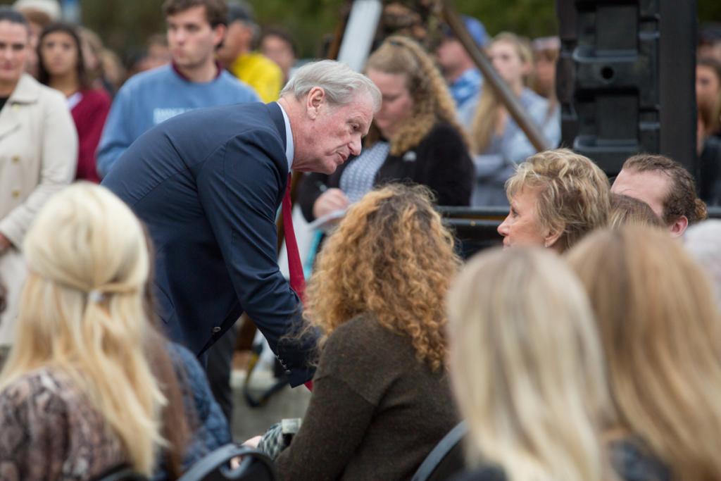 President John Thrasher comforts loved ones of the victims of an off-campus shooting during a candlelight vigil Nov. 4, 2018. (FSU Photography Services)