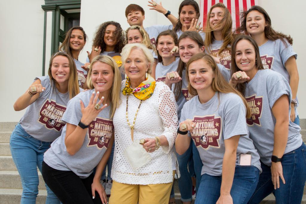 FSU First Lady Jean Thrasher poses with members of the 2017 NCAA Championship soccer team during FSU Day at the Capitol Feb. 6, 2018. (FSU Photography Services)