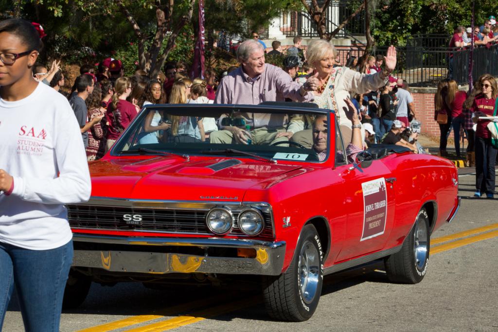 John and Jean Thrasher wave to the crowd during FSU's Homecoming Parade Nov. 7, 2014. (FSU Photography Services)